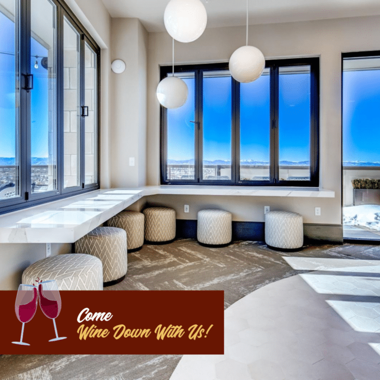 Lounge area at Arabelle Lincoln Station apartments with Wine Down branding